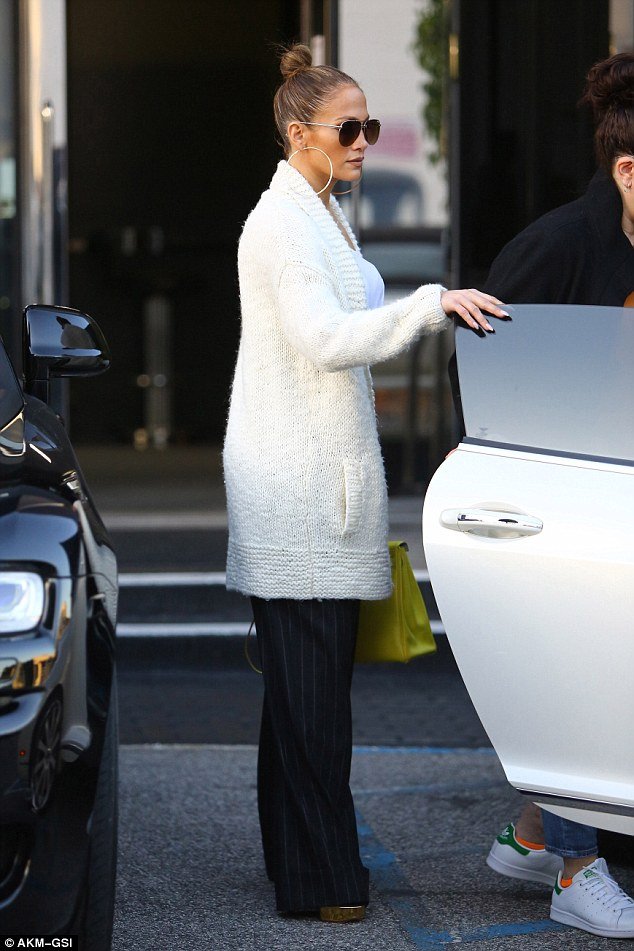 What a lady! JLo held open the door for one of her shopping pals 