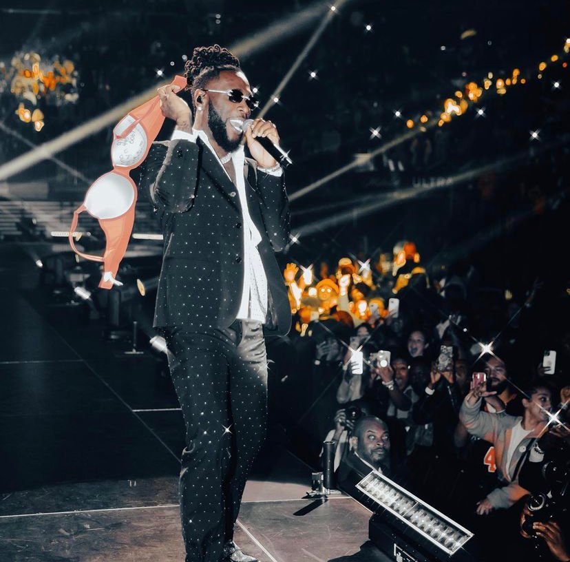 Burna Boy is soaring over the crowd at Amsterdam’s Ziggo Dome, yelling the Yoruba term that loosely means “move your legs.